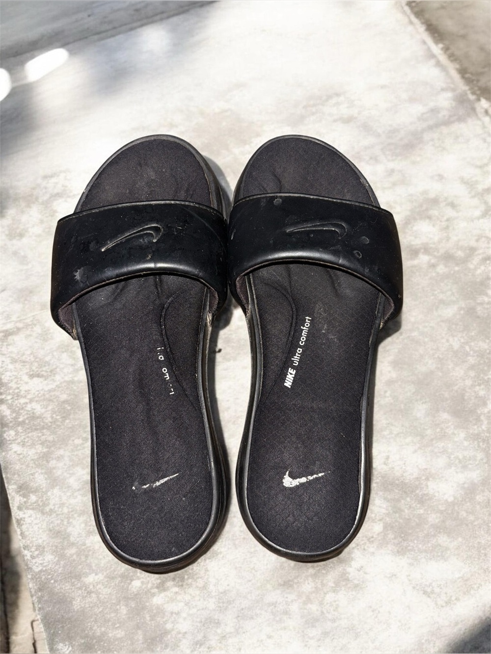Well worn Nike sandals with memory foam
